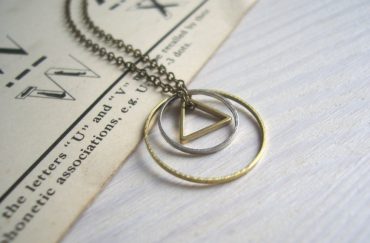 Shopping in Manchester: A necklace with two circles and a triangle