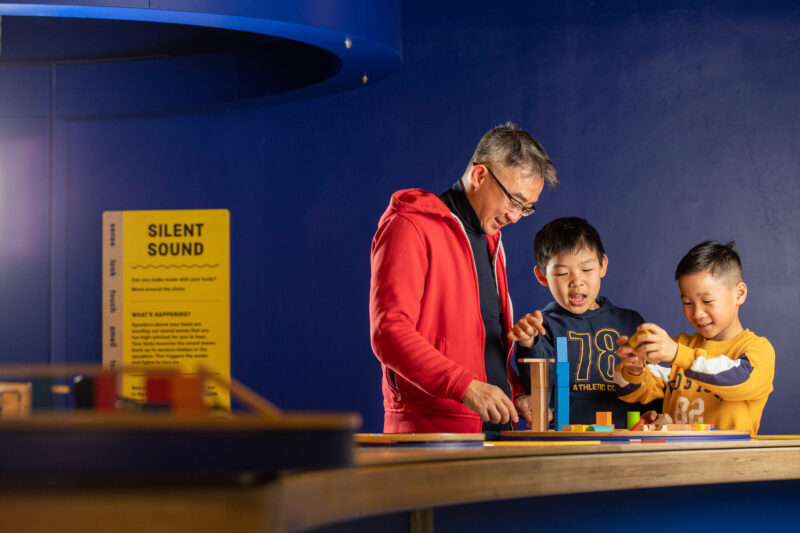 Family in Experiment gallery - Science Museum Group - © The Board of Trustees of the Science Museum. Photo by Chris Foster.