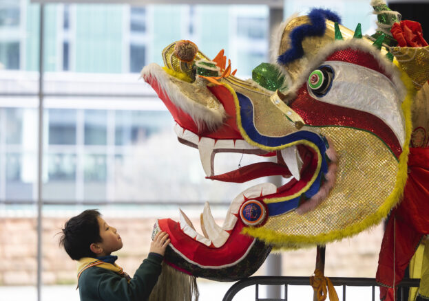 EDITORIAL USE ONLY Performer Kaiyuan Bao prepares to take part in the Dragon Parade as part of Manchester’s Chinese New Year Celebrations to welcome in the Year of the Rabbit. Picture date: Sunday January 22, 2023. PA Photo. This year’s celebrations, organised by the Federation of Chinese Associations of Manchester (FCAM), in partnership with Manchester Business Improvement District (BID) and Manchester City Council, will also see a week long residency of traditional street food stalls in the city’s Piccadilly Gardens from today to Sunday January 29 and a final performance from an illuminated night dragon to close this year’s festivities next Sunday in Piccadilly Gardens. Photo credit should read: Fabio De Paola/PA Wire.