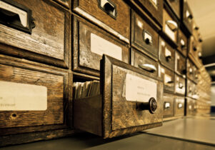 Antique wooden storage boxes in a Archive