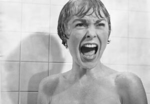 A black and white still from Psycho featuring a screaming Marion Crane played by Janet Leigh.