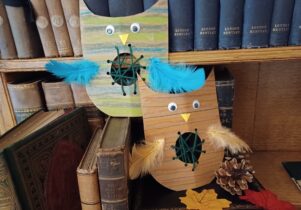 Children's owl craft displayed on books October Half Term at Elizabeth Gaskell's House