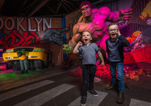 Two children stood in front of the Hulk