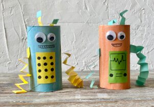 Two colourful 'robots' made from kitchen rolls and different coloured paper. Half term junkbots at people's history museum