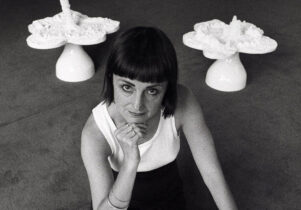 Helen Chadwick posing with a sculpture called Piss Flowers taken during the exhibition Helen Chadwick: Effluvia, held at the Serpentine Gallery, London, in 1994