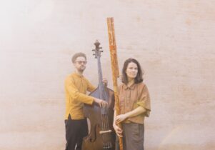 2 musicians with their instruments (a double bass and Slovak traditional fujara flute)