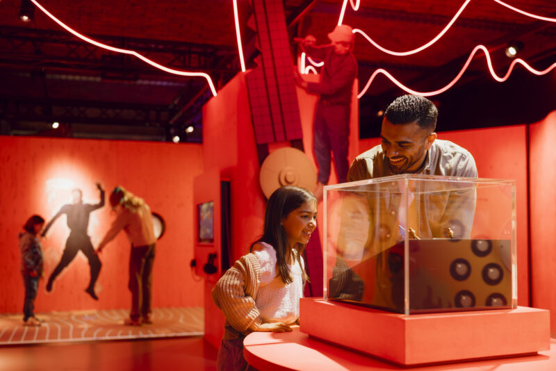 Father and daughter looking at a sundial display in Horrible Science: Cosmic Chaos