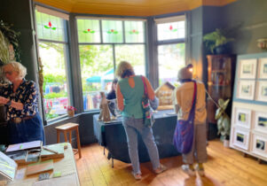 Visitors browsing the open houses at Green Walk