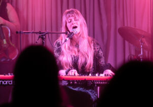 Singer playing keyboard